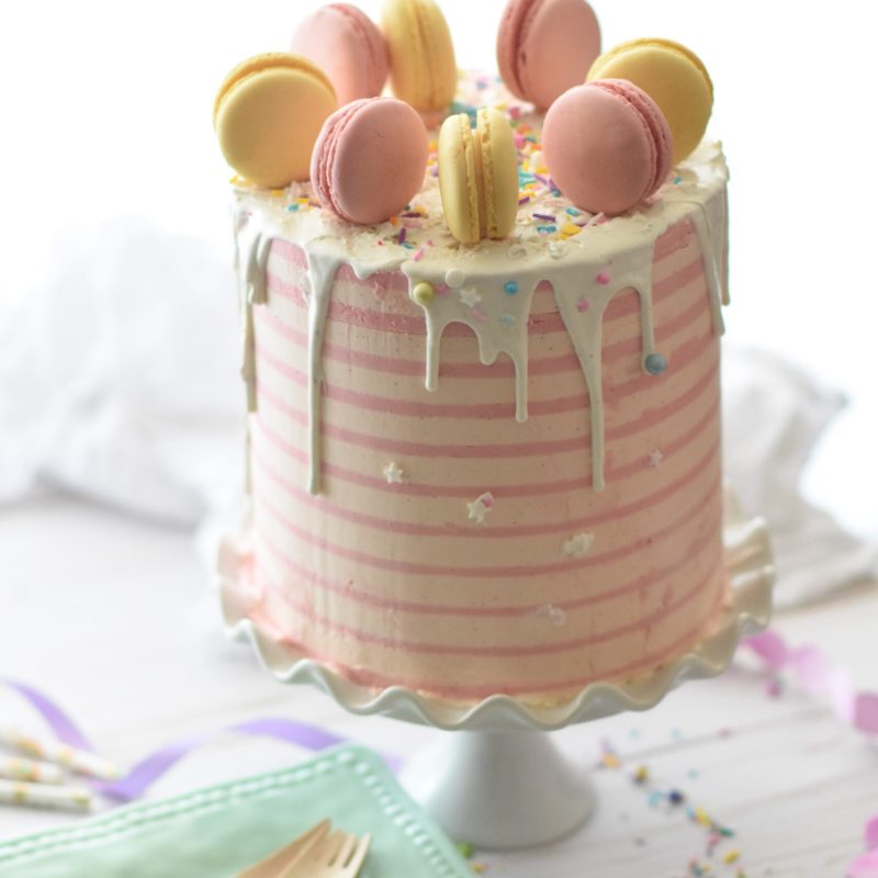 Pink striped cake with macarons